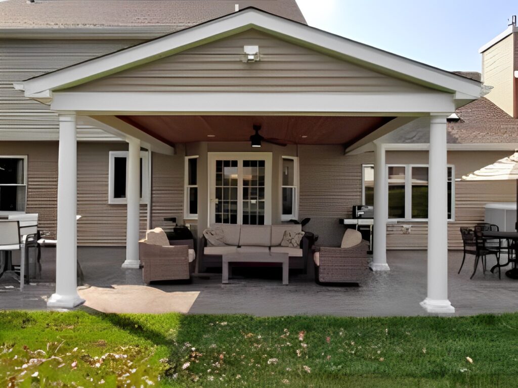 a-covered-patio-with-a-table-and-chairs