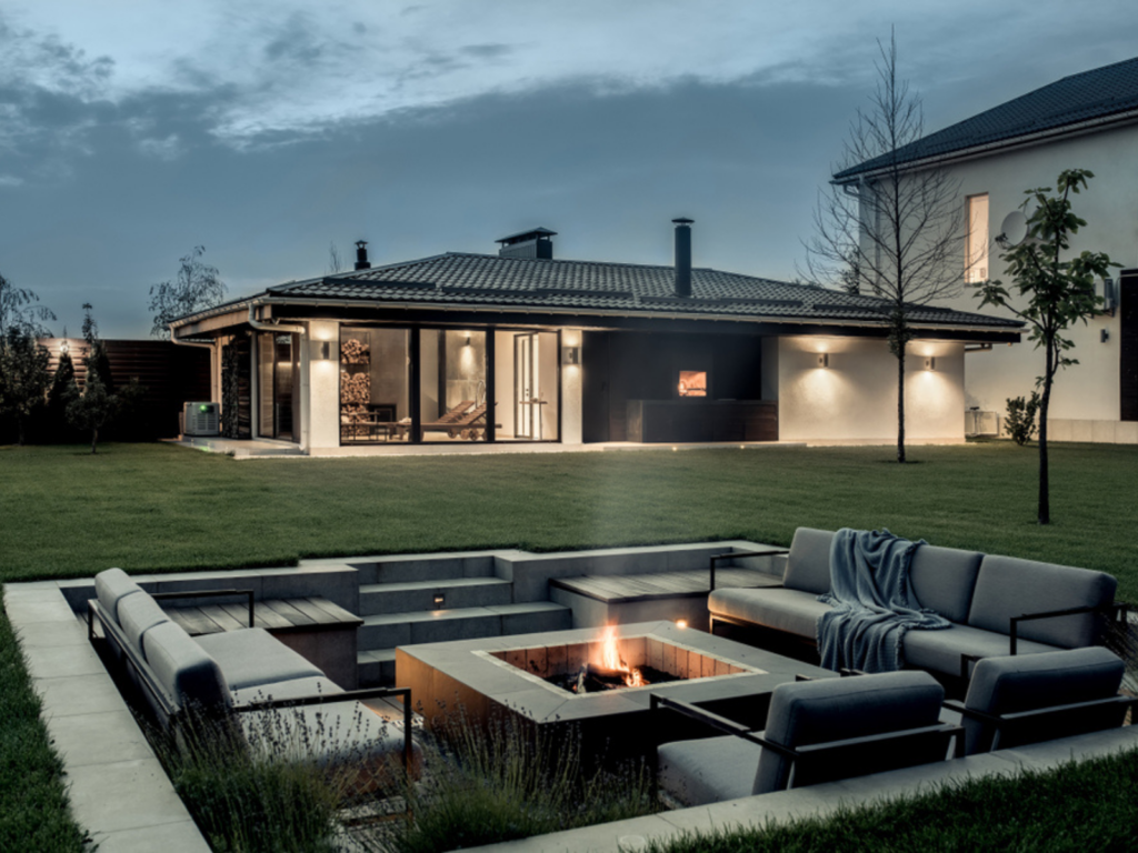 a-patio-with-a-fire-pit-in-the-middle-of-it